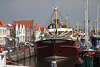 Zierikzee Port Schiffe Hafenpromenade Foto malerische Huser am Wasser Reisebild