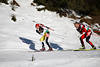 816124_Slowake Pavol Hurajt Foto vor sterreicher Daniel Mesotitsch Biathletenpaar Schatten auf Schneeloipe skifahren