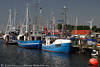 Fischkutter Flotte am Hafenkai in Burgstaaken Fehmarn Foto blaue Schiffe im Wasser